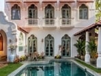 The villa boasts intricate Indo-Portuguese architecture, a tranquil outdoor space, and thoughtfully designed interiors.