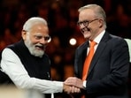 Prime Minister Narendra Modi, left, shakes hands with Australian Prime Minister Anthony Albanese during an Indian community event at Qudos Bank Arena in Sydney, Australia.