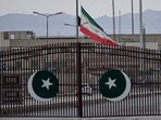 An Iranian flag flies at half-mast at the Pakistan-Iran border crossing at Taftan, Balochistan province 