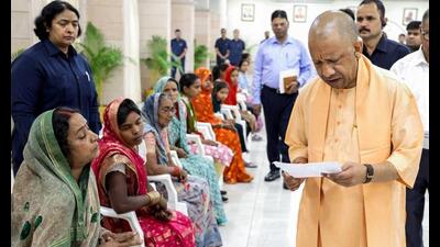 Chief minister Yogi Adityanath listens to public grievances during the Janata Darshan, in Lucknow on Monday. (@CMOfficeUP/ANI Photo)