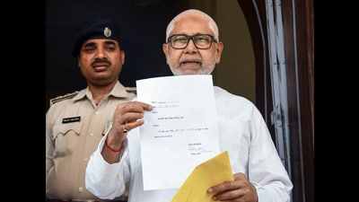 JD(U) MLC Sanjay Gandhi displays Nitish Kumar’s resignation letter from the Bihar Legislative Council at the Bihar Vidhan Sabha in Patna on Monday. (ANI photo) JD(U) MLC Sanjay Gandhi displays Nitish Kumar’s resignation letter from the Bihar Legislative Council at the Bihar Vidhan Sabha in Patna on Monday. (ANI photo)