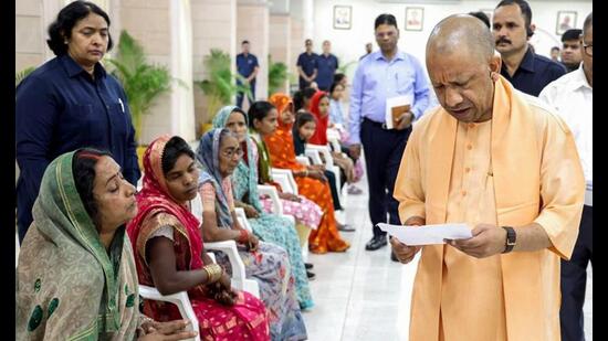 Chief minister Yogi Adityanath listens to public grievances during the Janata Darshan, in Lucknow on Monday. (@CMOfficeUP/ANI Photo)