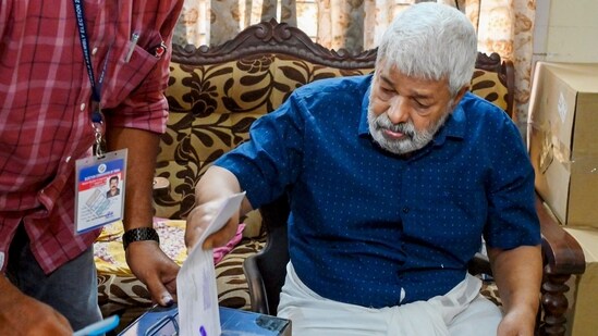 Bhaskara Kurup, 86, casts his vote as part of home voting at his residence ahead of the Kerala Legislative Assembly election. (PTI)