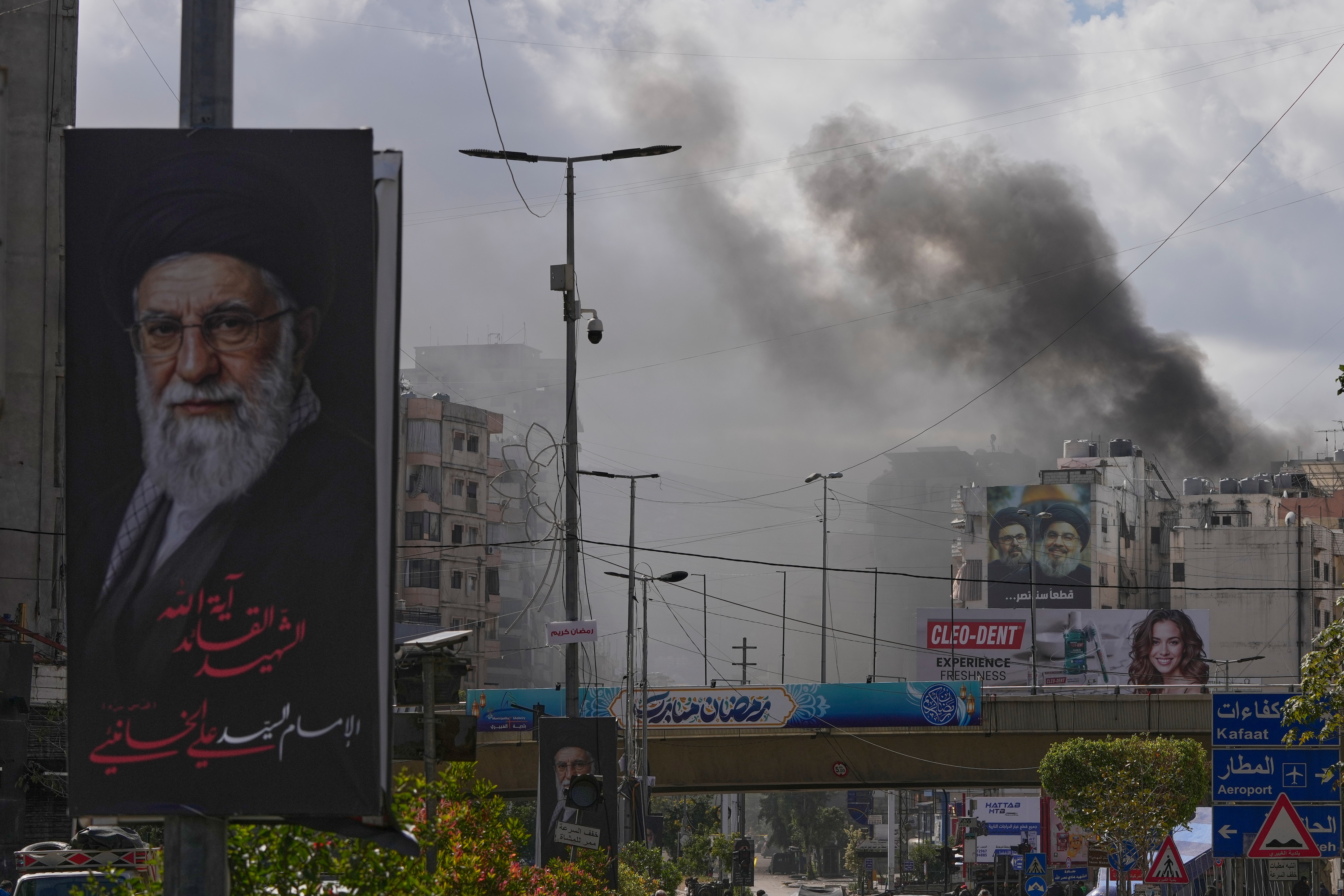 A portrait of Iran's late Supreme Leader Ayatollah Ali Khamenei, left, as smoke rises following an Israeli airstrike in Dahiyeh, Beirut's southern suburbs, in Lebanon on March 30, 2026. (Hassan Ammar/AP Photo) A portrait of Iran's late Supreme Leader Ayatollah Ali Khamenei, left, as smoke rises following an Israeli airstrike in Dahiyeh, Beirut's southern suburbs, in Lebanon on March 30, 2026. (Hassan Ammar/AP Photo)