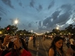 Visitors relish the pleasant weather as dark clouds hover over Kartavya Path.