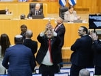 Israel's minister of national security, Itamar Ben-Gvir, and other lawmakers celebrate after the parliament passed a law approving the death penalty for Palestinians convicted of murdering Israelis, at the Knesset in Jerusalem Monday, March 30, 2026. Israel's minister of national security, Itamar Ben-Gvir, and other lawmakers celebrate after the parliament passed a law approving the death penalty for Palestinians convicted of murdering Israelis, at the Knesset in Jerusalem Monday, March 30, 2026.