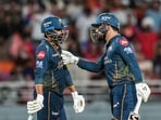 Gujarat Titans' Rashid Khan, right, and Rahul Tewatia during an Indian Premier League (IPL) 2026 T20 cricket match between Punjab Kings and Gujarat Titans
