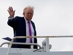 US President Donald Trump waves as he boards Air Force One at Palm Beach International Airport in West Palm Beach, Florida, U.S., March 29, 2026.
