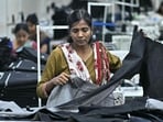 A woman working at a textile unit in India. EY sees India's textile industry as among the most impacted by the ongoing Iran war.