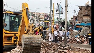 Nine illegally built shops were demolished after due process by civic authorities and PWD officials. (HT)