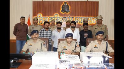 The four accused of the fake currency racket in police custody on Tuesday (HT Photo)