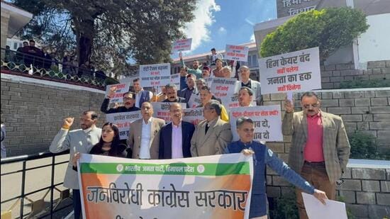 Leader of opposition Jai Ram Thakur along with BJP legislators protesting against the entry tax hike, outside the Himachal Pradesh Vidhan Sabha in Shimla on Tuesday. (Deepak Sansta/HT)