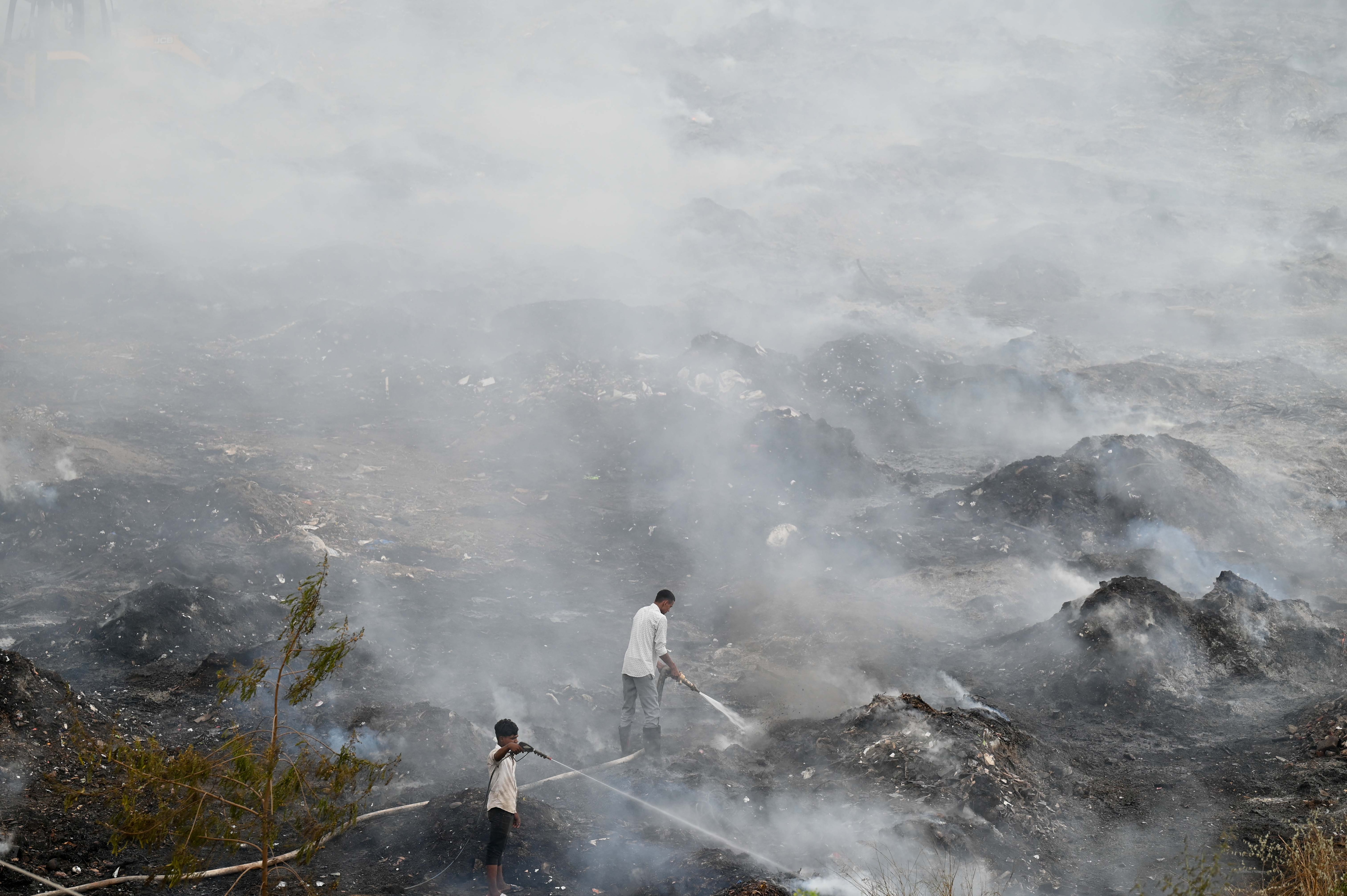 Firefighting was hindered by lack of earthmovers, which were arranged only the next day, officials said. (Parveen Kumar/HT) Firefighting was hindered by lack of earthmovers, which were arranged only the next day, officials said. (Parveen Kumar/HT)
