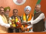 BJP leaders welcoming HS Phoolka into the party in New Delhi on Wednesday. (HT Photo)