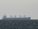 FILE PHOTO: A cargo ship in the Gulf, near the Strait of Hormuz, as seen from northern Ras al-Khaimah, near the border with Oman’s Musandam governance, amid the U.S.-Israeli conflict with Iran, in United Arab Emirates (REUTERS)