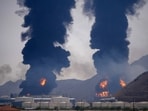 Plumes of smoke and fire rise after debris from an intercepted Iranian drone struck an oil facility, according to authorities, in Fujairah, United Arab Emirates, March 14.