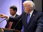 President Donald Trump, right, joined by Solicitor General John Sauer, as Trump speaks with reporters