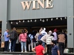 Long queues were seen at liquor stores on Tuesday as vendors offered booze at almost half rates or even less as they cleared the stock before the onset of the new financial year. (Ravi Kumar/HT) Long queues were seen at liquor stores on Tuesday as vendors offered booze at almost half rates or even less as they cleared the stock before the onset of the new financial year. (Ravi Kumar/HT)
