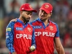 Punjab Kings' captain Shreyas Iyer, left, has a word with Marcus Stoinis