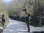 Security personnel stand guard during a search operation, in Ganderbal, Jammu and Kashmir, on Wednesday. (Waseem Andrabi/HT)