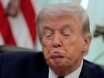 FILE: US President Donald Trump reacts as he speaks during the signing ceremony for an executive order on mail ballots, in the Oval Office of the White House in Washington. 