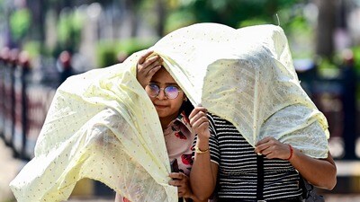 Prayagraj: People cover themselves while walking on a hot summer day, in Prayagraj, Uttar Pradesh, Sunday, March 29, 2026. (PTI Photo)(PTI03_29_2026_000058A) (PTI) Prayagraj: People cover themselves while walking on a hot summer day, in Prayagraj, Uttar Pradesh, Sunday, March 29, 2026. (PTI Photo)(PTI03_29_2026_000058A) (PTI)
