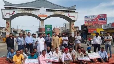 Protesters blocking the Chandigarh-Dharamshala highway at Mehatpur on Wednesday. (HT Photo)