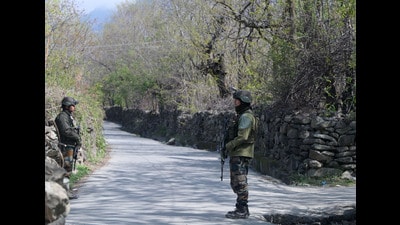 Security personnel stand guard during a search operation, in Ganderbal, Jammu and Kashmir, on Wednesday. (Waseem Andrabi/HT)