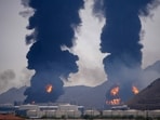 Plumes of smoke and fire rise after debris from an intercepted Iranian drone struck an oil facility, according to authorities, in Fujairah, United Arab Emirates, March 14.(AP)