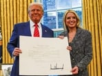 President Donald Trump and former Attorney General Pam Bondi pose during her swearing-in ceremony at the White House