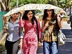 Students take cover under a scarf in Panchkula on a sunny Thursday. The mercury climbed from 32.8°C to 35.7°C in the past 24 hours, 3.1 degrees above normal and highest so far this season. (Sant Arora/HT)