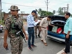Malda: Security personnel conduct naka checking of vehicles along National Highway 12 (NH 12) as part of election security measures, in Malda Malda: Security personnel conduct naka checking of vehicles along National Highway 12 (NH 12) as part of election security measures, in Malda