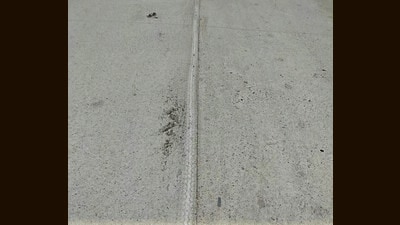 Residents have alleged that substandard material was used in construction of the road leading to cracks. (HT Photo) Residents have alleged that substandard material was used in construction of the road leading to cracks. (HT Photo)