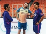 Jos Buttler interacts with Vaibhav Sooryavanshi.