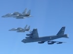 This photo provided by Japan's Ministry of Defense shows the Japan Air Self-Defense Force's F-15 fighters holding a joint military drill
