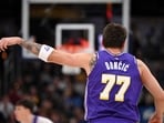 Los Angeles Lakers guard Luka Doncic (77) celebrates a three point shot during the first quarter against the Indiana Pacers 