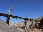 An airstrike on a bridge in Iran killed at least eight civilians during a Nature Day celebration. Iran condemned the attack as a moral collapse.