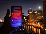 FILE: An alert issued by the UAE Ministry of Interior warning residents of Dubai and Abu Dhabi of a potential Iranian missile strike is displayed on a mobile phone.