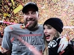 Travis Kelce, left, and Taylor Swift pose after the AFC Championship NFL football game against the Buffalo Bills