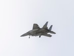 An Israeli Air Force F-15 fighter jet flies over the outskirts of Tel Aviv on March 20, 2026