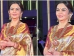 Nita Ambani looked gorgeous in a six yard drape that shimmered like molten gold.