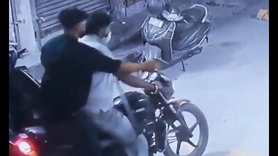 A CCTV grab of the attackers while escaping in Ludhiana on Friday; and (right) police at the spot. (HT Photo) A CCTV grab of the attackers while escaping in Ludhiana on Friday; and (right) police at the spot. (HT Photo)