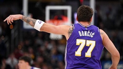 Los Angeles Lakers guard Luka Doncic (77) celebrates a three point shot during the first quarter against the Indiana Pacers (IMAGN IMAGES via Reuters Connect)