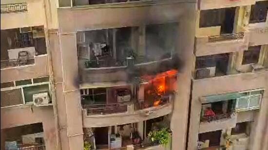 A flat on the second floor of a high-rise in Raj Nagar Extension caught fire on Friday afternoon. (Sakib Ali /HT photo)