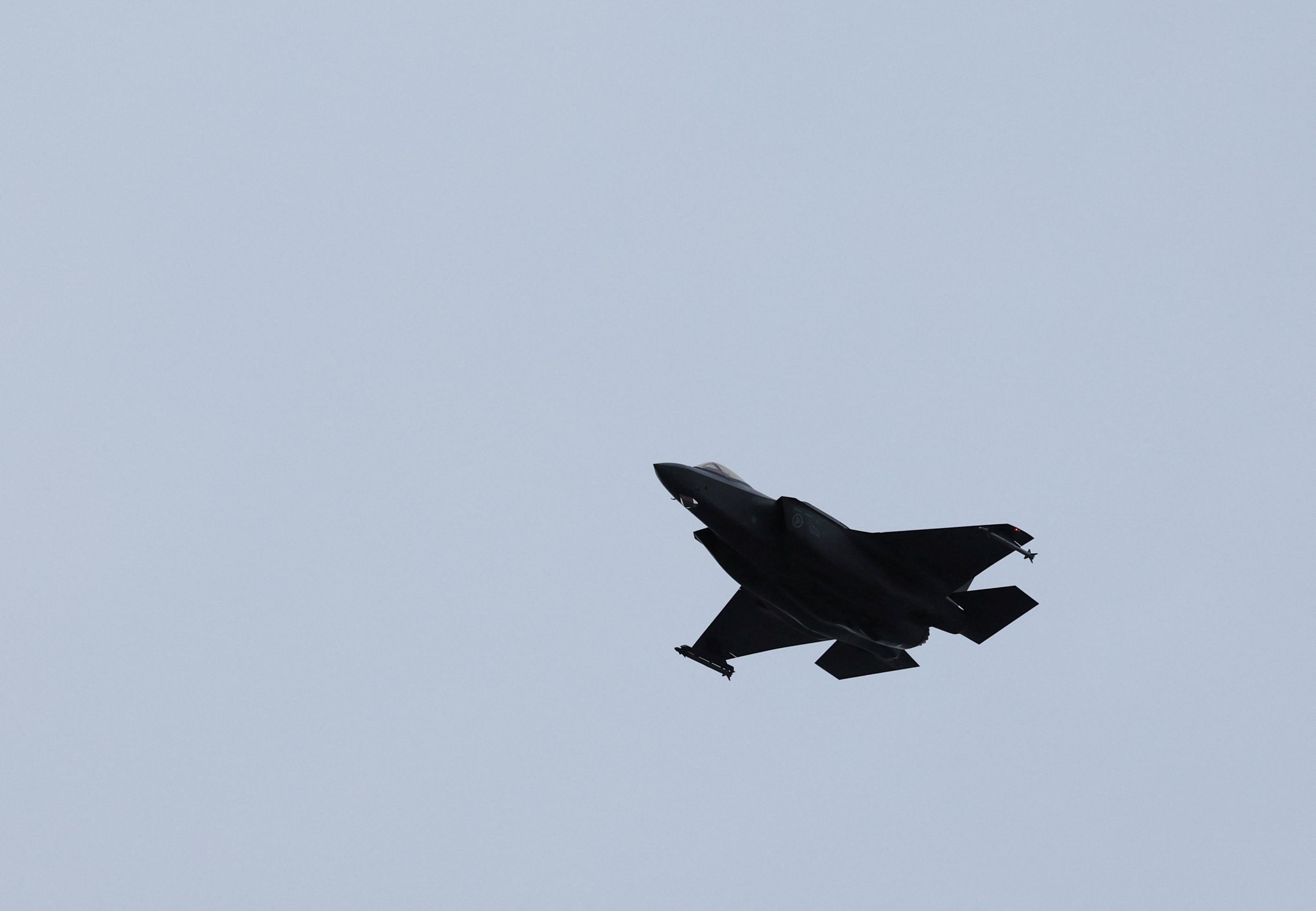 An F-35 fighter jet flies over Evenes air base during the NATO Cold Response 2026 military exercise in Arctic Norway, March 11, 2026. (REUTERS)