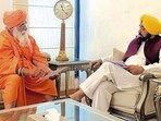 Chief minister Bhagwant Mann with MP Balbir Singh Seechewal in Chandigarh on Saturday. (HT Photo)