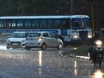 Commuters caught unawares during the rain in Chandigarh on Friday. (Keshav Singh/ HT)