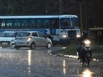 Commuters caught unawares during the rain in Chandigarh on Friday. 