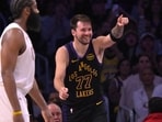 Los Angeles Lakers guard Luka Doncic (77) reacts after a basket in the second half against the Cleveland Cavaliers 