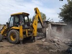 Officials used four earthmovers; civic body plans revival of water body as public asset with work expected to take six months to one year. (HT)